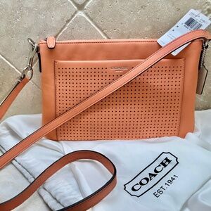 COACH 48979 Legacy Perforated East West Swingpack Bag, Adjustable Strap, Coral